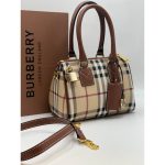 Signature Aesthetic: Showcases the world-renowned monogram pattern in a classic Brown and burgundy colorway. Luxury Hardware: Adorned with polished gold-toned eyelets and signature logo charms for instant brand recognition. premium presentation: your purchase is delivered with brand box and with brand dust bag for a complete luxury experience. structured silhouette: features a boxy duffel design with reinforced rounded handles for durability and style. exquisite detailing: finished with high-quality embroidery and precise stitching that highlights the brand’s artistry. Designed for both elegance and utility, this duffel-style handbag features sturdy rounded top handles for a graceful carry. The compact size ensures it remains a versatile choice for various occasions, while the vibrant color contrast provides a striking visual anchor.