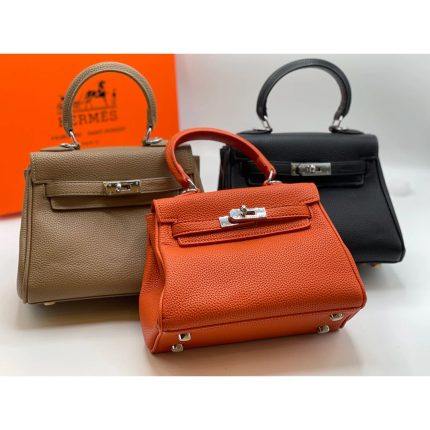 HERMES KELLY TOGO 25 RETURNS ORANGE HANDBAG.