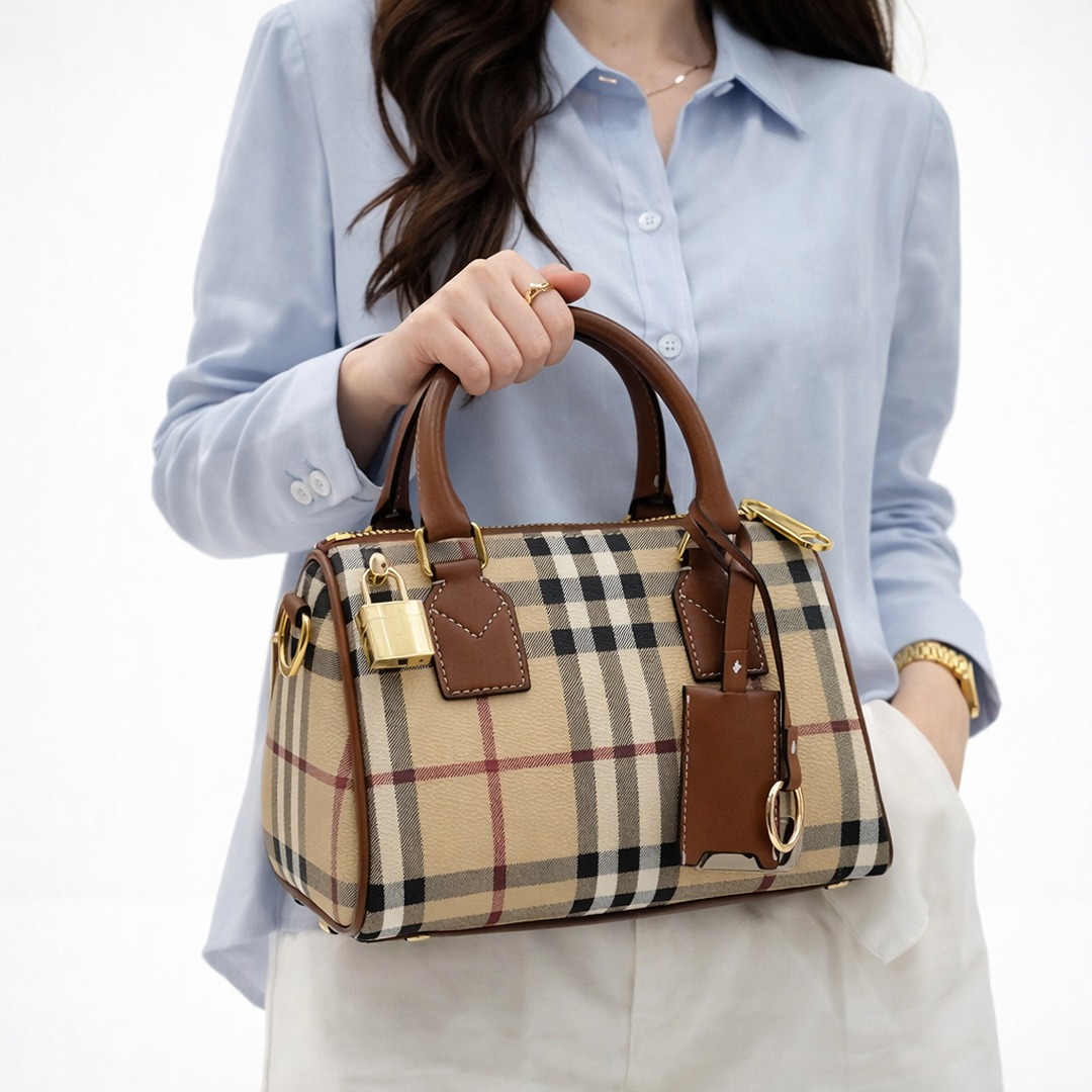 Signature Aesthetic: Showcases the world-renowned monogram pattern in a classic Brown and burgundy colorway. Luxury Hardware: Adorned with polished gold-toned eyelets and signature logo charms for instant brand recognition. premium presentation: your purchase is delivered with brand box and with brand dust bag for a complete luxury experience. structured silhouette: features a boxy duffel design with reinforced rounded handles for durability and style. exquisite detailing: finished with high-quality embroidery and precise stitching that highlights the brand’s artistry. Designed for both elegance and utility, this duffel-style handbag features sturdy rounded top handles for a graceful carry. The compact size ensures it remains a versatile choice for various occasions, while the vibrant color contrast provides a striking visual anchor.