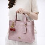 COACH SIGNATURE PINK PATENT MINI TOTE BAG WITH CHERRY CHARM