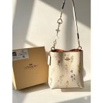 COACH CREAM MOLLIE TOWN BUCKET SIGNATURE CANVAS BAG