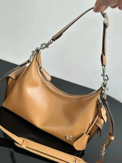 Coach Pocket Juliet Beige Bag.